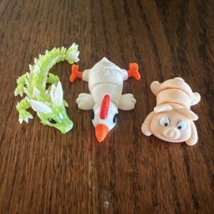 Bring Joy to Your Day with Small Articulated Animals and Creatures! Add a touch of whimsy to your world with our fun and friendly collection of 3D-printed animals and creatures. From playful dragons and charming farm animals to fascinating sea creatures and beyond, there's something for everyone to enjoy. Each figure is carefully printed for maximum movement and personality. New designs are always in the works, so check back often to see what magical friends have joined the collection!