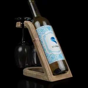 a wine bottle holder with two stemmed wine glasses